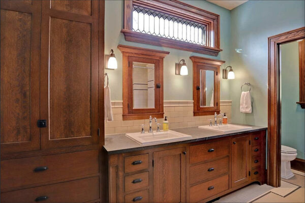 Historic Craftsman-style Renovation: Bathroom; Appleton, WI. Although this bathroom is brand new, it looks as if all is original in this early 1900s home — from the custom cabinetry to the soapstone counter top with authentic Heritage tile back splash.